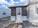 An enclosed patio featuring a storm door at 4986 Foxwood Lake Dr, Lakeland, FL 33810