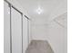 Bright walk-in closet features sliding doors, wire shelving, and a neutral-colored floor for storage at 4986 Foxwood Lake Dr, Lakeland, FL 33810