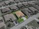 Aerial view of a single-story home with a brick driveway and tropical landscaping in a residential neighborhood at 5325 Nicklaus Dr, Winter Haven, FL 33884