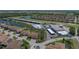 Expansive aerial view showcasing community with housing, water features, and recreational facilities at 5325 Nicklaus Dr, Winter Haven, FL 33884