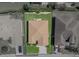 Overhead shot of a single-story home with lush green lawn, brick driveway, and neutral facade at 5325 Nicklaus Dr, Winter Haven, FL 33884