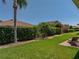 Well-maintained backyard with lush greenery and a brick patio for outdoor enjoyment at 5325 Nicklaus Dr, Winter Haven, FL 33884