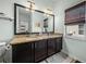 Bathroom featuring granite countertops, lots of storage, double sinks, and great lighting at 5325 Nicklaus Dr, Winter Haven, FL 33884