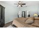 Comfortable bedroom featuring access to en-suite bathroom and office, and a ceiling fan at 5325 Nicklaus Dr, Winter Haven, FL 33884