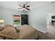 This bedroom offers ample space, a large wardrobe, and a window providing an exterior view at 5325 Nicklaus Dr, Winter Haven, FL 33884