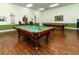 Well-appointed billiard room with a pool table and comfortable seating for relaxation and entertainment at 5325 Nicklaus Dr, Winter Haven, FL 33884
