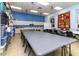 Bright craft room features large table, ample storage, and great lighting for creative projects at 5325 Nicklaus Dr, Winter Haven, FL 33884