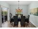Charming dining room with access to the outdoor area and ample natural light at 5325 Nicklaus Dr, Winter Haven, FL 33884