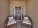 Welcoming front porch with wicker chairs and decorative wreath on the front door at 5325 Nicklaus Dr, Winter Haven, FL 33884
