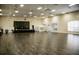 Spacious hall with stage, lighting and fans offers ample space for events and gatherings at 5325 Nicklaus Dr, Winter Haven, FL 33884