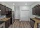 Spacious kitchen with stainless appliances, walk-in pantry, and wood-look flooring at 5325 Nicklaus Dr, Winter Haven, FL 33884