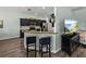 Eat-in kitchen featuring stainless appliances, granite countertops, and seating at the breakfast bar at 5325 Nicklaus Dr, Winter Haven, FL 33884