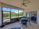 Inviting screened lanai for outdoor enjoyment, featuring ceiling fan and furniture at 5325 Nicklaus Dr, Winter Haven, FL 33884