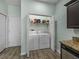 Convenient laundry closet with front load washer and dryer hookups, and extra storage space at 5325 Nicklaus Dr, Winter Haven, FL 33884