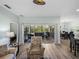 Light-filled living room with an easy flow to the covered and screened lanai and dining area at 5325 Nicklaus Dr, Winter Haven, FL 33884