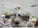Comfortable living room with sliding glass doors leading to an outdoor patio at 5325 Nicklaus Dr, Winter Haven, FL 33884
