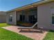 Exterior view showcasing screened patio with brick flooring, ideal for outdoor living at 5325 Nicklaus Dr, Winter Haven, FL 33884