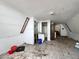 A full view of an attic featuring white walls, tile floors and ceiling fan at 5402 Parkway Drive, Belle Isle, FL 32809