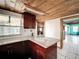 Bright kitchen featuring white tile floors, custom cabinets and granite counter tops at 5402 Parkway Drive, Belle Isle, FL 32809