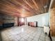 Room with wood ceiling, brick fireplace, and tile flooring at 5402 Parkway Drive, Belle Isle, FL 32809