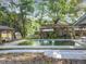 Backyard pool with pool side structures, perfect for relaxation and fun in the sun at 5402 Parkway Drive, Belle Isle, FL 32809