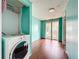 Room featuring hardwood floors, blue paint, and sliding glass doors at 5402 Parkway Drive, Belle Isle, FL 32809