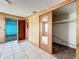Room with tile floor, wood paneled walls, and views of the neighboring rooms at 5402 Parkway Drive, Belle Isle, FL 32809