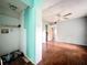 Room featuring hardwood floors and an open wall to the bedroom at 5402 Parkway Drive, Belle Isle, FL 32809