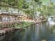 The property's waterfront with a gazebo highlights access to the canal at 5402 Parkway Drive, Belle Isle, FL 32809