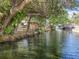 An idyllic waterfront with a gazebo highlighting access to the canal at 5402 Parkway Drive, Belle Isle, FL 32809