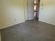 This is an empty bedroom with a closet and access to another room at 5512 Meander Ln, Lake Wales, FL 33898