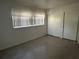 Bright bedroom featuring two large closets and one window at 5512 Meander Ln, Lake Wales, FL 33898