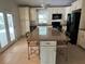 Wide shot of kitchen featuring granite countertops, and stainless appliances at 5512 Meander Ln, Lake Wales, FL 33898