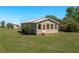 Charming single-story home with a new roof and a lush green yard at 555 Morrel Ave, Lake Wales, FL 33859