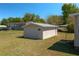 Exterior view of a backyard shed with 'Private Property' sign in a grassy yard next to the house at 555 Morrel Ave, Lake Wales, FL 33859