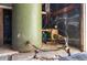Close-up of the well's pressure tank and pump system surrounded by exposed rafters at 555 Morrel Ave, Lake Wales, FL 33859