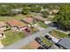 Aerial view of property showcasing its location, landscaping, and proximity to neighboring homes at 602 Turnberry Ct, Winter Haven, FL 33884