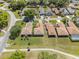 Aerial view showcasing the property's location within a well-maintained community, close to walking trails at 602 Turnberry Ct, Winter Haven, FL 33884