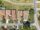 Aerial view of home in a well-maintained neighborhood with mature landscaping and inviting curb appeal at 602 Turnberry Ct, Winter Haven, FL 33884
