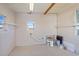 Clean garage with painted walls, bright lighting, and ample space for storage or projects at 6433 Jacaranda Ne Ave, Winter Haven, FL 33881