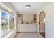 Cozy living room with built-in cabinets and a window with a view to the outdoors at 6433 Jacaranda Ne Ave, Winter Haven, FL 33881