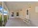 Covered patio with concrete flooring, offering an inviting outdoor space with access to the home at 6433 Jacaranda Ne Ave, Winter Haven, FL 33881