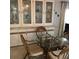 Close up of dining room with a glass table and bamboo chairs at 6515 Raintree Ne Ln, Winter Haven, FL 33881