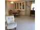 Formal dining area features bamboo chairs, glass table and a built-in cabinet at 6515 Raintree Ne Ln, Winter Haven, FL 33881