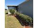 Landscaping and covered patio at 6515 Raintree Ne Ln, Winter Haven, FL 33881