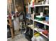 Messy garage with tools and shelving at 6515 Raintree Ne Ln, Winter Haven, FL 33881