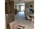 Open living space with a dining area that flows seamlessly to a kitchen with an island and lots of light at 6515 Raintree Ne Ln, Winter Haven, FL 33881