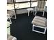 Covered patio with chairs and a small table at 6515 Raintree Ne Ln, Winter Haven, FL 33881