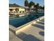 Large outdoor pool perfect for swimming and relaxing, surrounded by a spacious sun deck at 6515 Raintree Ne Ln, Winter Haven, FL 33881