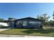 Charming single-story home featuring a well-manicured lawn, dark brick exterior, and a cozy, inviting curb appeal at 707 Great Barford St, Auburndale, FL 33823